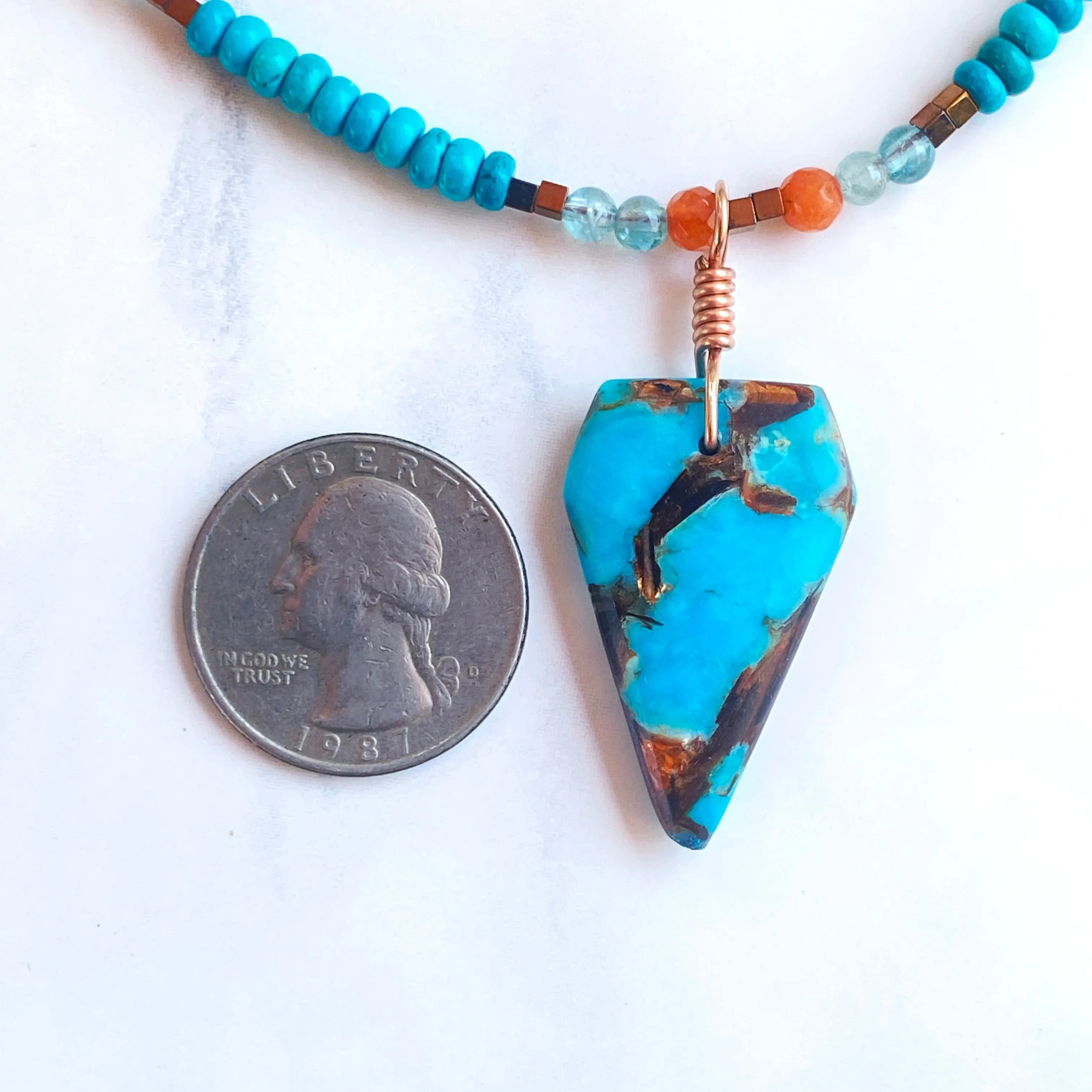 Bornite gemstone arrowhead pendant on Blue Howlite beaded necklace